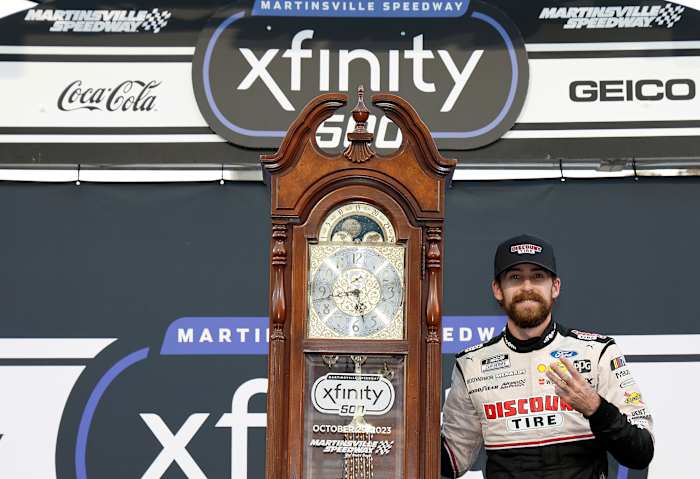 Ryan Blaney celebrates with the traditional grandfather's clock awarded to race winners at Martinsville Speedway after winning Sunday's NASCAR Cup Series Xfinity 500. sending him to the Championship 4 title-deciding race next Sunday in Phoenix. (Photo by Chris Graythen/Getty Images)